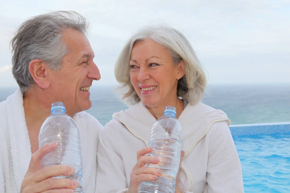 man and woman drink water